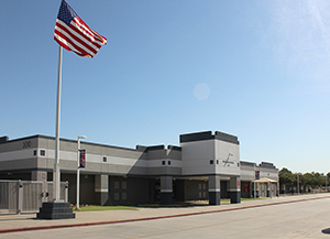 Centennial school front with American flag